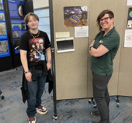 USGS scientist and FALA student at Art of inquiry show