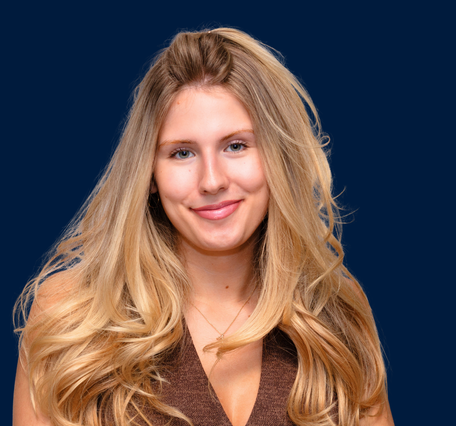 Headshot of a woman with long blond hair 