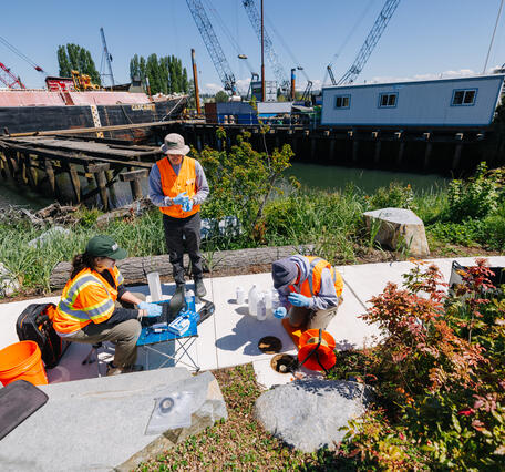Scientists use equipment to measure well