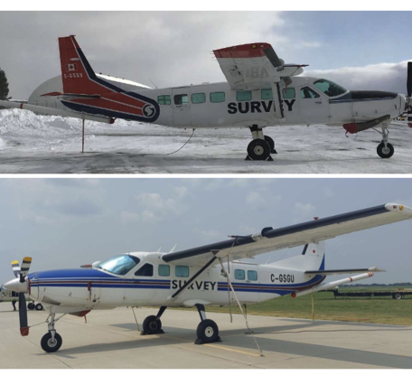 Two propeller planes with metal sensor booms extending.