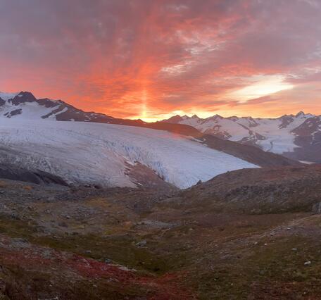 Orange sunrise over a glacier
