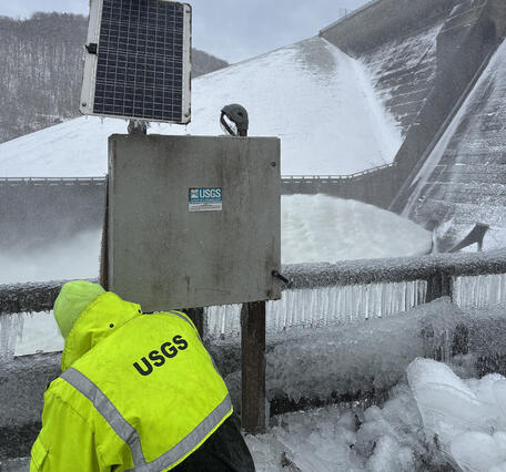 Technician removes a water quality deployment for the winter.