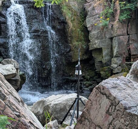 Air sampling equipment at base of waterfall