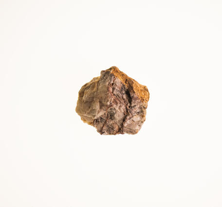 Isolated USGS mineral specimen of barite with visible crystal faces and granular texture.