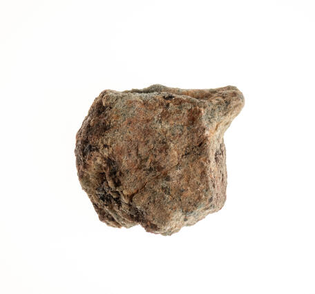 High-definition image of beryllium ore with visible mineral inclusions and rough texture.