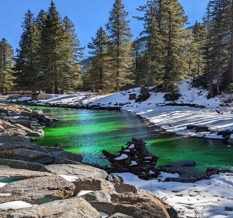 Image of dye in water during dye tracer study on the Slate River