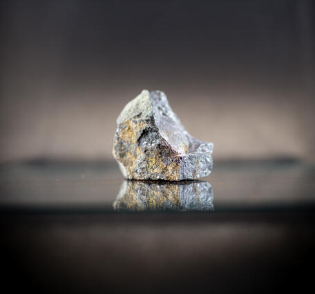 High-definition image showing granular texture and dark coloration.