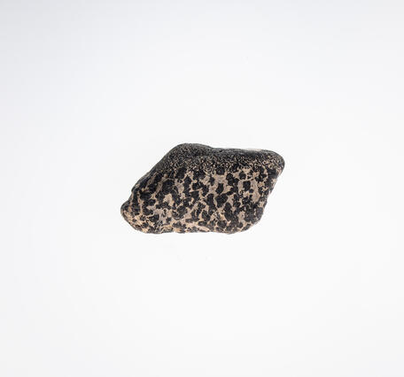 High-definition image of chromite specimen with visible crystal grains and dark coloration.