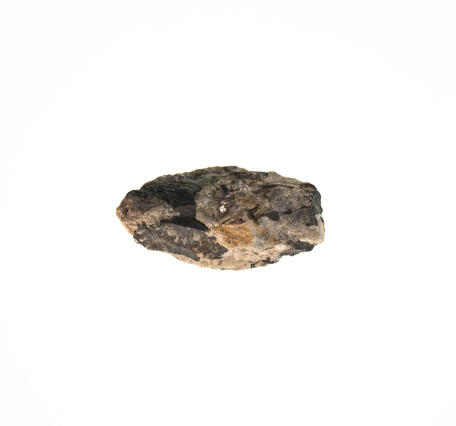 High-definition image of a second columbite-tantalite specimen, showing its dark coloration, rough surface.