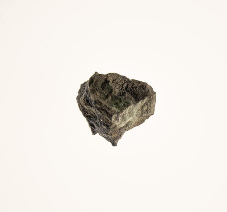  Isolated mineral specimen featuring covellite and pyrite, captured in high resolution.
