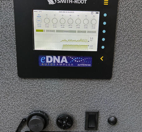 An eDNA autosampler console screen on the inside of the lid