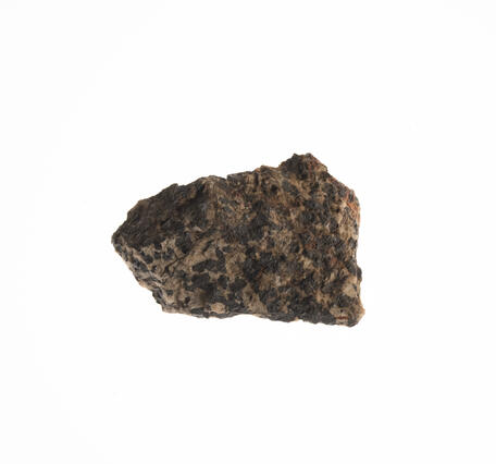 Isolated USGS mineral specimen featuring franklinite, zincite, and calcite.