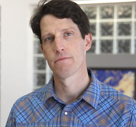 Mugshot of cleanshaven man with dark hair
