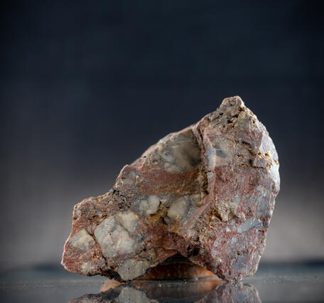 USGS mineral specimen of gold ore with 0.5 oz per short ton.