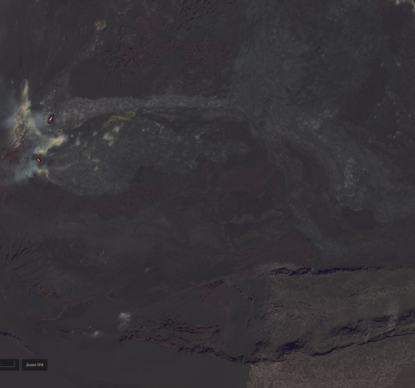 Color satellite image showing eruptive vents glowing red within a crater covered with dark colored lava flows