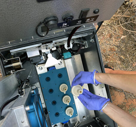 An inside view of the components of an eDNA autosampler device