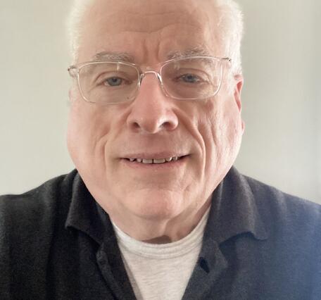TNMCorps volunteer MRWert513 wearing glasses and a collared shirt. 