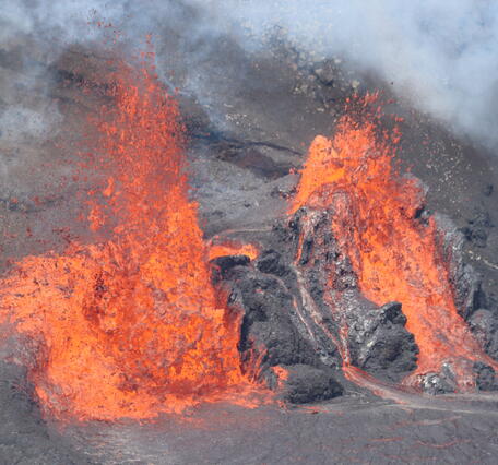 Color photograph of vents erupting lava
