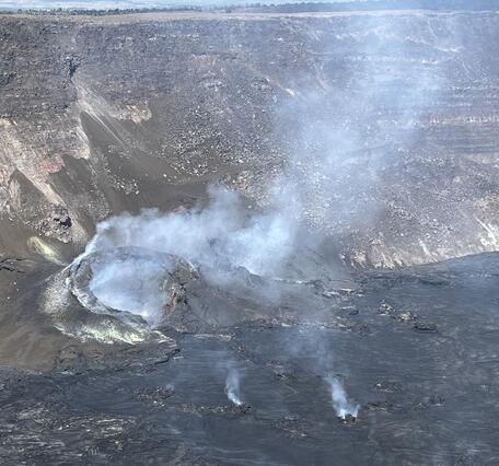 Color photograph of volcanic vents degassing