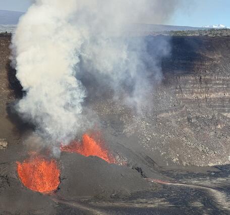 Color photograph of vents erupting lava