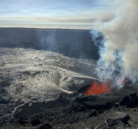 Color photograph of vents erupting lava