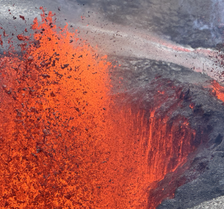 Close up view of lava fountain building up a cone around it