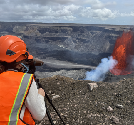 A scientist collects data from vigorous lava fountaining during episode 14