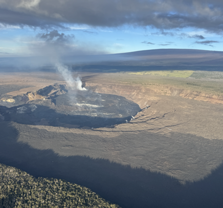 Color photograph of crater at summit of volcano 