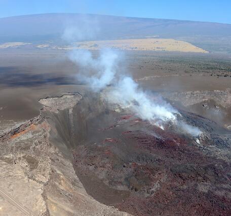 Color photograph of volcanic eruptive vents in crater