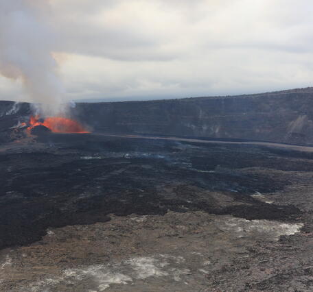 Color photograph of eruption within crater