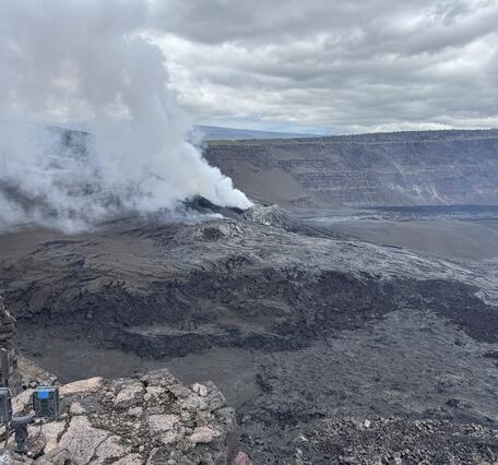 Color photograph of volcanic vents degassing