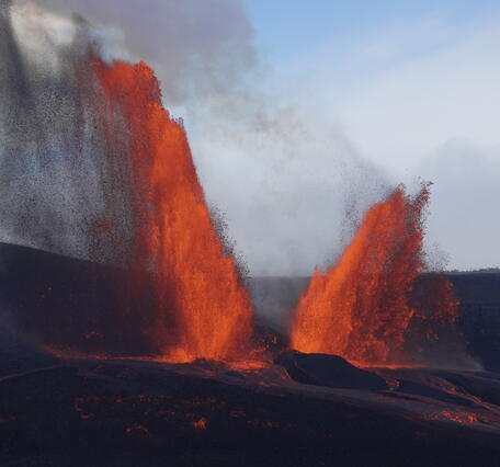 Color photograph of dual lava fountains