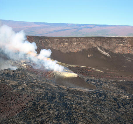 Color photograph of volcanic vent degassing