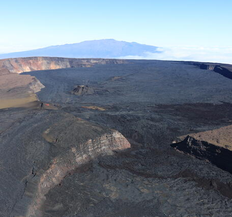 Color photograph of summit caldera at top of volcano