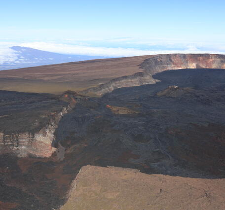 Color photograph of summit caldera at top of volcano