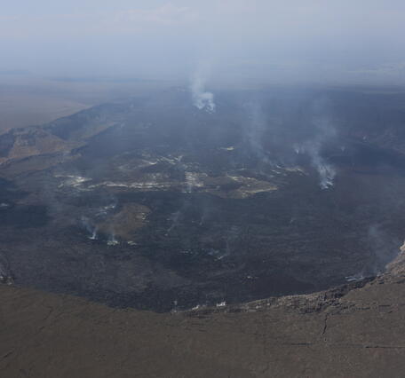 Color photograph of volcanic crater degassing