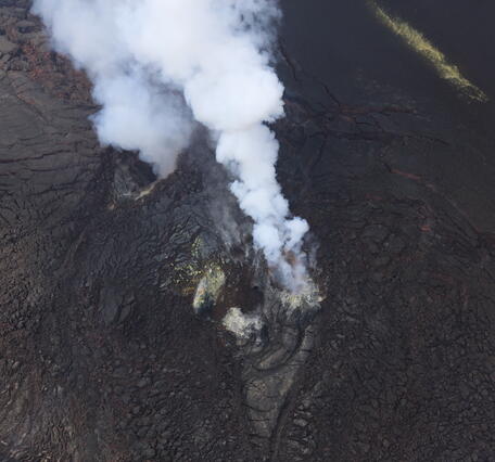Color photograph of volcanic vents degassing