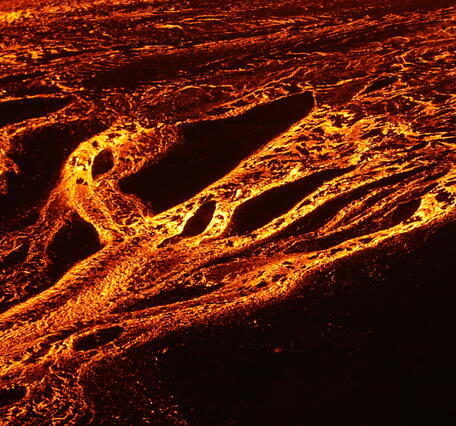 Color photograph of lava channels at night