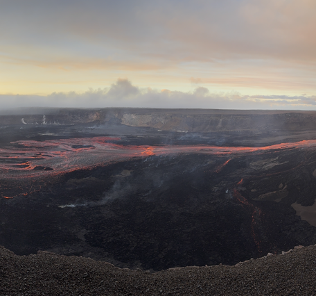 Color panoramic photograph of volcanic eruption within crater
