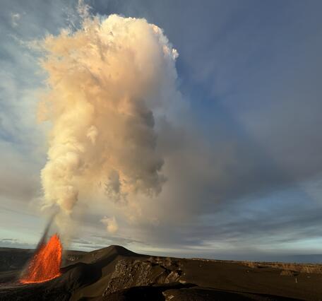 Color photograph of lava fountain and volcanic plume