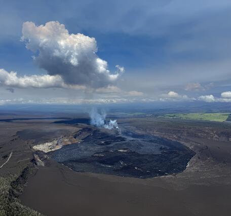 Color photograph of caldera at summit of volcano