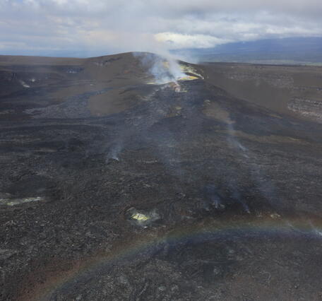 Color photograph of volcanic vents degassing