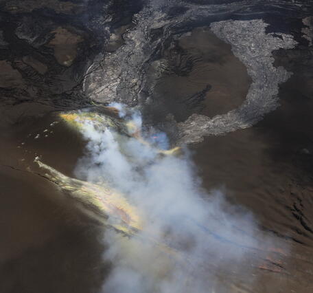 Color photograph of volcanic vents degassing