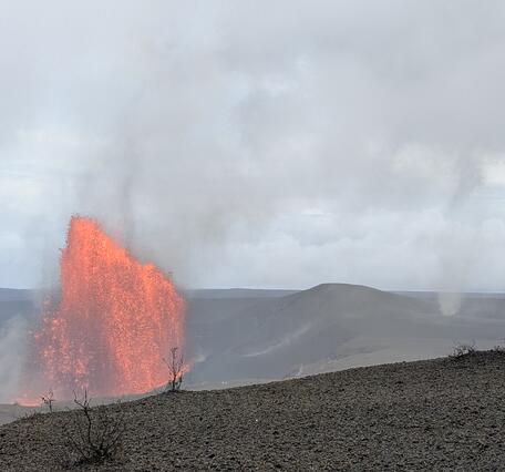 Color photograph of lava fountain and whirlwind