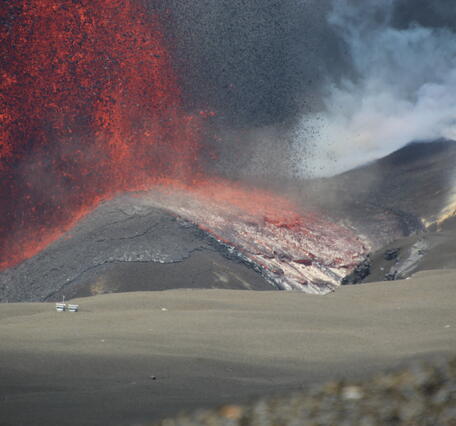 Color photograph of lava fountain base with lava flow