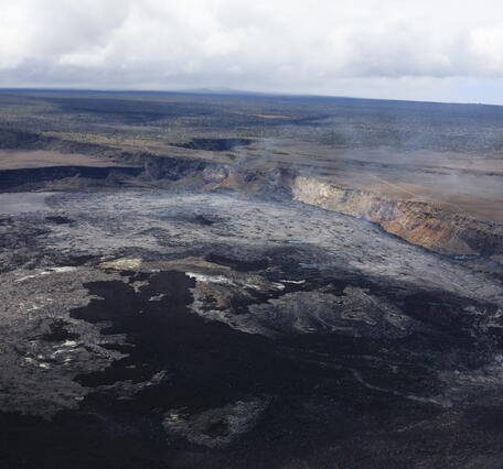 Color photograph of crater with lava flows in it