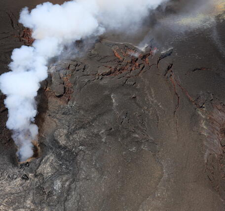 Color photograph of volcanic vent degassing