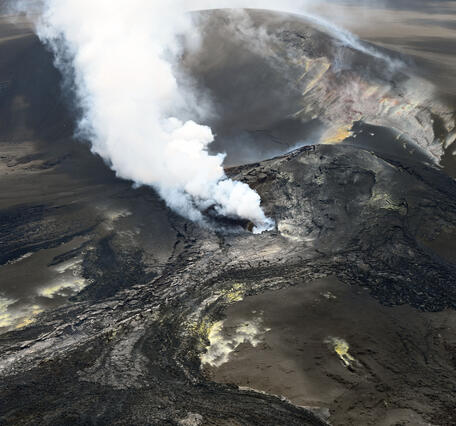 Color photograph of volcanic vents degassing