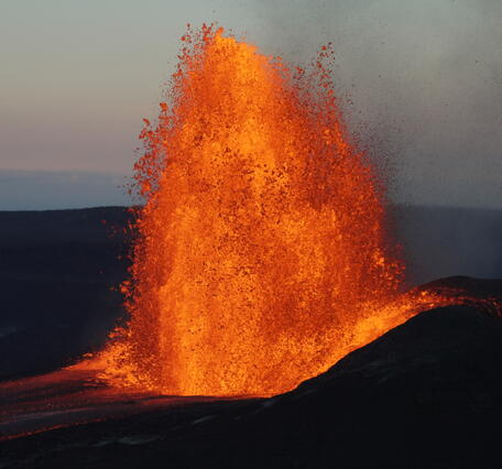 Color photograph of lava fountain in the evening
