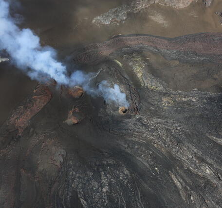 Color photograph of volcanic vents degassing
